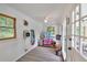 Bright pool house with windows, ceiling fan, door to the pool area, and functional space for towels, pool toys, etc at 146 Henderson Farm Ln, Canton, GA 30115