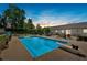 Backyard swimming pool is perfect for summer fun, complemented by a diving board and spacious patio area with lounge chairs at 146 Henderson Farm Ln, Canton, GA 30115
