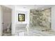 Luxurious bathroom featuring a soaking tub, glass shower, and marble floors at 3785 Lower Roswell Rd, Marietta, GA 30068