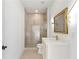 Bathroom featuring modern gold hardware and fixtures, and tiled shower at 3785 Lower Roswell Rd, Marietta, GA 30068
