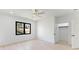 Bedroom featuring modern fan, large window, closet, and light hardwood floors at 3785 Lower Roswell Rd, Marietta, GA 30068