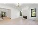 Elegant living room with a modern fireplace, large windows, and hardwood flooring at 3785 Lower Roswell Rd, Marietta, GA 30068