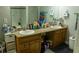 Bathroom with double sinks and granite countertop in a home at 5590 Stonewood Court Ct, Norcross, GA 30093