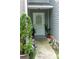 Inviting entrance with decorative plants and charming walkway lights at 5590 Stonewood Court Ct, Norcross, GA 30093