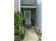Warm, inviting entrance with charming decor, featuring plants and walkway lights at 5590 Stonewood Court Ct, Norcross, GA 30093