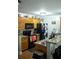Functional kitchen featuring oak cabinets, granite countertops, and black appliances at 5590 Stonewood Court Ct, Norcross, GA 30093