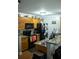 Functional kitchen featuring oak cabinets, granite countertops, and black appliances at 5590 Stonewood Court Ct, Norcross, GA 30093