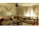 Comfortable living room featuring a plush sofa and abundant natural light at 5590 Stonewood Court Ct, Norcross, GA 30093