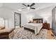 Comfortable bedroom featuring an ensuite bathroom and hardwood floors at 904 Ivy Green Se Ln, Marietta, GA 30067