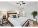 Comfortable bedroom with hardwood floors, a plush bed, and neutral decor at 904 Ivy Green Se Ln, Marietta, GA 30067
