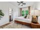 Inviting bedroom boasts hardwood floors, area rug, and large windows at 904 Ivy Green Se Ln, Marietta, GA 30067