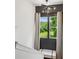 Upstairs hallway with window seat overlooking green landscape at 904 Ivy Green Se Ln, Marietta, GA 30067