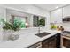 Kitchen featuring quartz countertops, stainless appliances and views into the living area at 904 Ivy Green Se Ln, Marietta, GA 30067