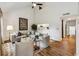 Open-concept living room with vaulted ceilings, hardwood floors and light neutral colors at 904 Ivy Green Se Ln, Marietta, GA 30067