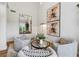 Living room featuring tall ceilings, stylish decor, and view of backyard with a swimming pool at 904 Ivy Green Se Ln, Marietta, GA 30067