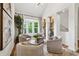 Bright living room showcasing modern decor, vaulted ceilings, and bay windows at 904 Ivy Green Se Ln, Marietta, GA 30067