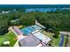 Overhead view of community amenities including a pool, tennis courts, and lakeside access at 9176 Lakeview Pkwy, Villa Rica, GA 30180