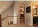 Upstairs hallway with access to a bedroom with bunk beds and a full bathroom at 9176 Lakeview Pkwy, Villa Rica, GA 30180