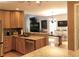 Open kitchen with granite countertops, stainless steel appliances, and hardwood floors at 9176 Lakeview Pkwy, Villa Rica, GA 30180