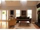 Bright living room with high ceilings, a cozy fireplace, and natural light from large windows at 9176 Lakeview Pkwy, Villa Rica, GA 30180