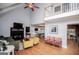 Spacious living room with hardwood floors, vaulted ceiling, and ample seating at 9176 Lakeview Pkwy, Villa Rica, GA 30180