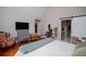 Spacious main bedroom features high ceilings, hardwood floors, and an attached bathroom with sliding barn door at 9176 Lakeview Pkwy, Villa Rica, GA 30180