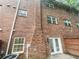 Brick back exterior with a back door, a/c, and electrical meter at 6354 Shannon Pkwy # 8B, Union City, GA 30291