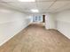 Expansive basement area featuring neutral carpeting, ample space, and convenient access to the exterior at 6354 Shannon Pkwy # 8B, Union City, GA 30291