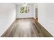 Bright dining area with hardwood floors, classic wainscoting, and abundant natural light at 6354 Shannon Pkwy # 8B, Union City, GA 30291