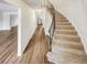 Inviting entryway with hardwood floors and staircase leading to the upper level of the home at 6354 Shannon Pkwy # 8B, Union City, GA 30291