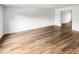 Empty living room showing beautiful floors and access to other rooms at 6354 Shannon Pkwy # 8B, Union City, GA 30291