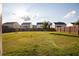 Large, grassy backyard with a wood fence, ideal for outdoor activities at 905 Eldridge Rd, Hampton, GA 30228