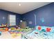 Blue-walled bedroom with carpet, and grey furniture, and abc-themed decorations at 905 Eldridge Rd, Hampton, GA 30228