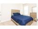 Cozy bedroom with a comfortable bed, dresser, and a window for natural light at 905 Eldridge Rd, Hampton, GA 30228