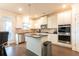 Eat-in kitchen featuring granite countertops, stainless steel appliances, and a central island for added workspace at 905 Eldridge Rd, Hampton, GA 30228