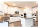 Well-equipped kitchen featuring granite countertops, stainless steel appliances, and white cabinetry at 905 Eldridge Rd, Hampton, GA 30228