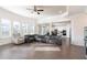 Large living room with hardwood floors, recessed lighting, and multiple windows providing ample sunlight at 905 Eldridge Rd, Hampton, GA 30228