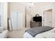 This bedroom boasts a spacious closet, neutral carpeting and walls, and a modern dresser for ample storage at 1856 Temple Park Dr, Loganville, GA 30052