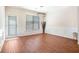 Bright dining room with wainscoting, wooden floors, modern lighting, and a patio door at 1856 Temple Park Dr, Loganville, GA 30052