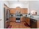 Well-equipped kitchen featuring stainless steel appliances, ample counter space, and wood cabinetry at 1856 Temple Park Dr, Loganville, GA 30052