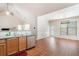 Well-lit kitchen features modern stainless steel appliances and a breakfast nook with wood floors at 1856 Temple Park Dr, Loganville, GA 30052