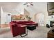 Cozy living room featuring vaulted ceilings, a fireplace, comfortable seating, and an open layout at 1856 Temple Park Dr, Loganville, GA 30052