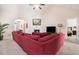 Comfortable living room boasts plush seating, fireplace, and seamless flow to other living areas at 1856 Temple Park Dr, Loganville, GA 30052
