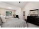 Large bedroom with a window, a view and a set of drawers with a mirror at 1856 Temple Park Dr, Loganville, GA 30052