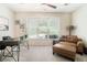 Bright office space with large window, plush chair, and a contemporary desk at 1856 Temple Park Dr, Loganville, GA 30052