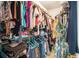 Walk-in closet full of clothes and personal belongings at 1856 Temple Park Dr, Loganville, GA 30052