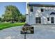 Concrete patio with a stone firepit and house at 2035 Lena Carter Rd, Buford, GA 30519