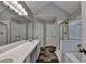 Bathroom featuring tiled floors, shower, bathtub, double sinks, and a full-length mirror at 2035 Lena Carter Rd, Buford, GA 30519
