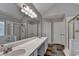 Bright bathroom features a double vanity, tiled shower and separate tub, with natural light at 2035 Lena Carter Rd, Buford, GA 30519