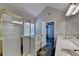 Bright bathroom with double sinks, shower, and access to the bedroom at 2035 Lena Carter Rd, Buford, GA 30519
